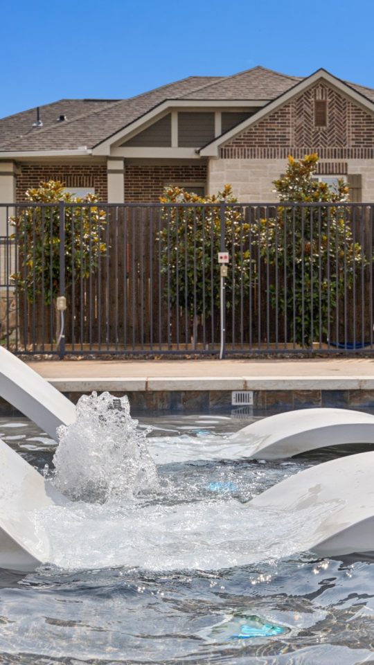 Shelf seating in the community pool at VLux Stoneridge